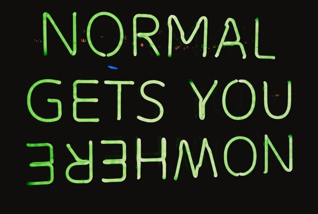 Neon sign that reads, Normal Gets You Nowhere